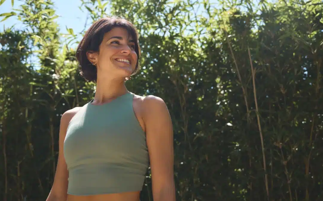 Hispanic woman wearing sportswear enjoying summer